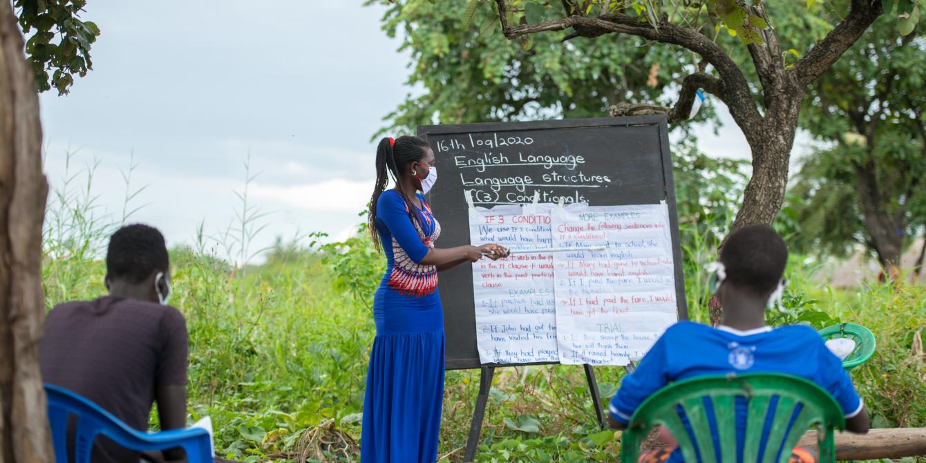 Jennifer Akongo Sunthia, 24, Teacher in Palabek refugee settlement conducting a learning session in one of her students' home
